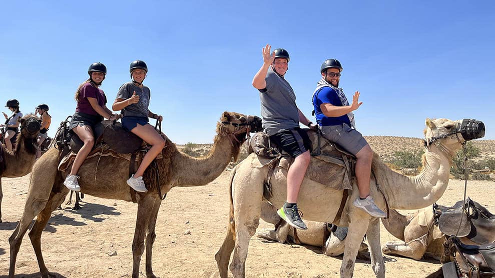 Teens on a camel ride